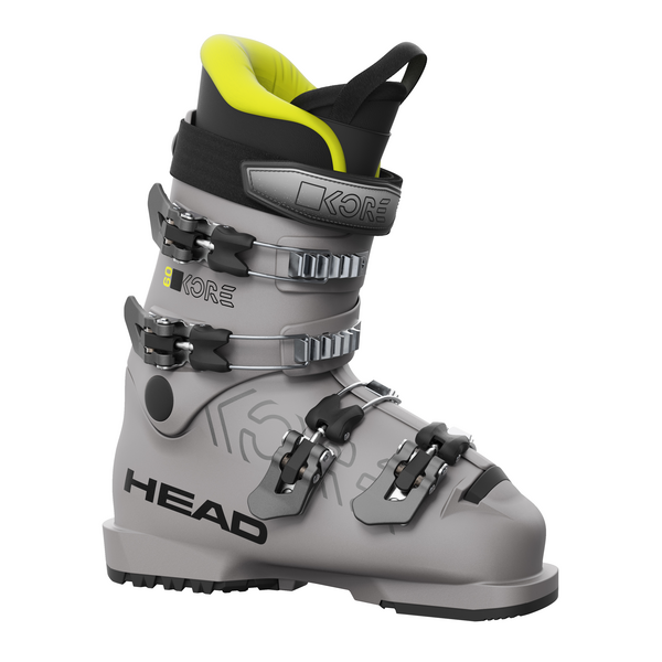 Grauer Head Kore 60 Skischuh für Junior mit Schnallen und gelbem Innenschuh, seitliche Logos.