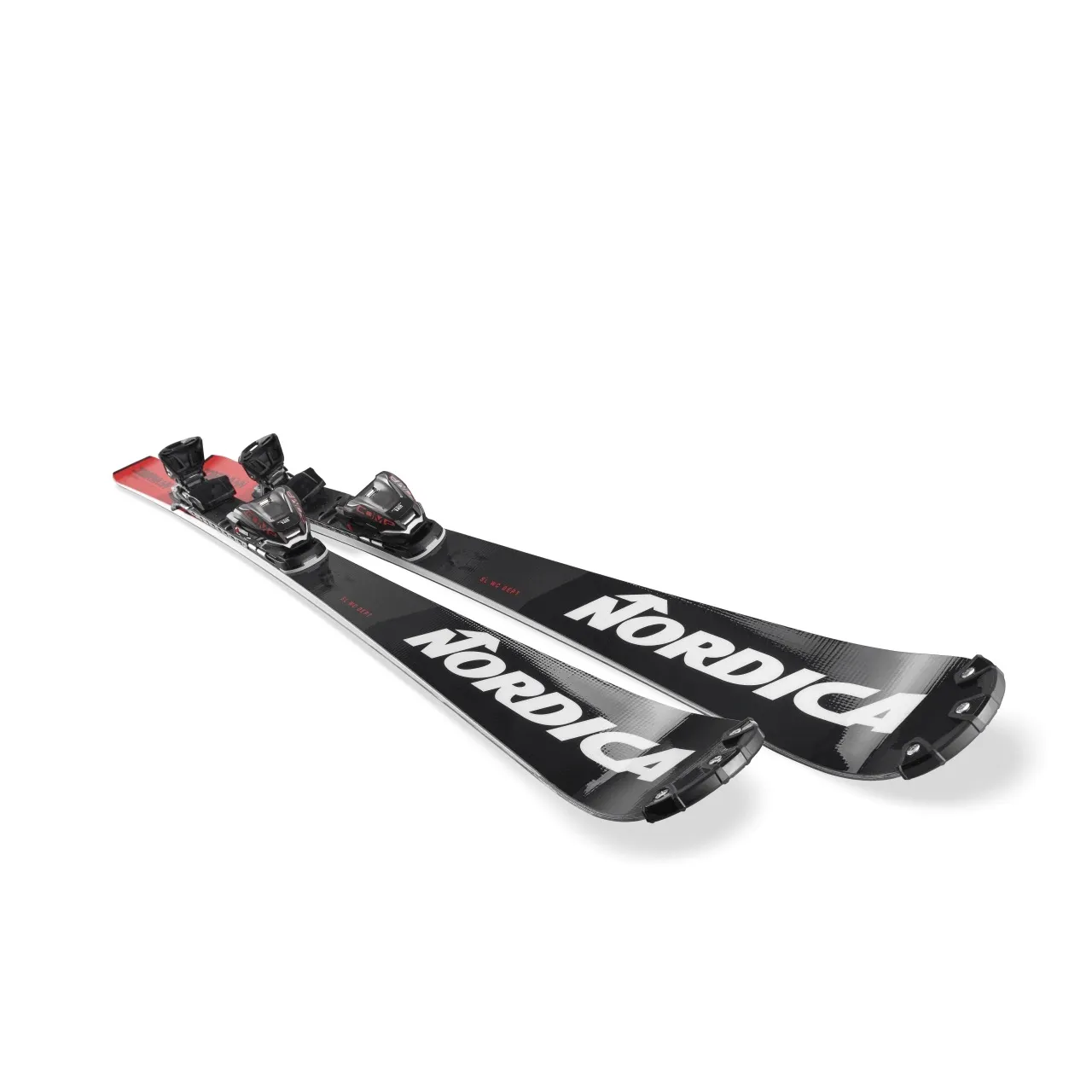 A pair of black and white Nordica Ski, with red accents and bindings, lie diagonally on a white surface.