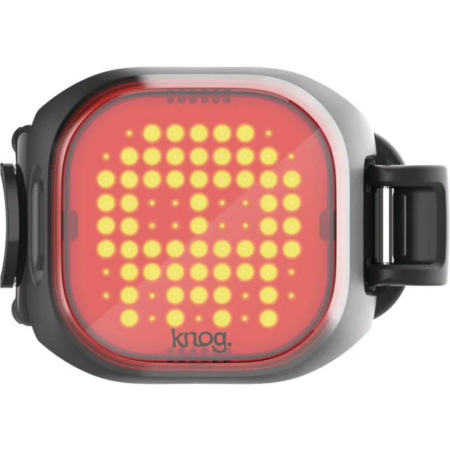 Mini lampe arrière noire en forme de crâne avec des LED jaunes et un rétroéclairage rouge.