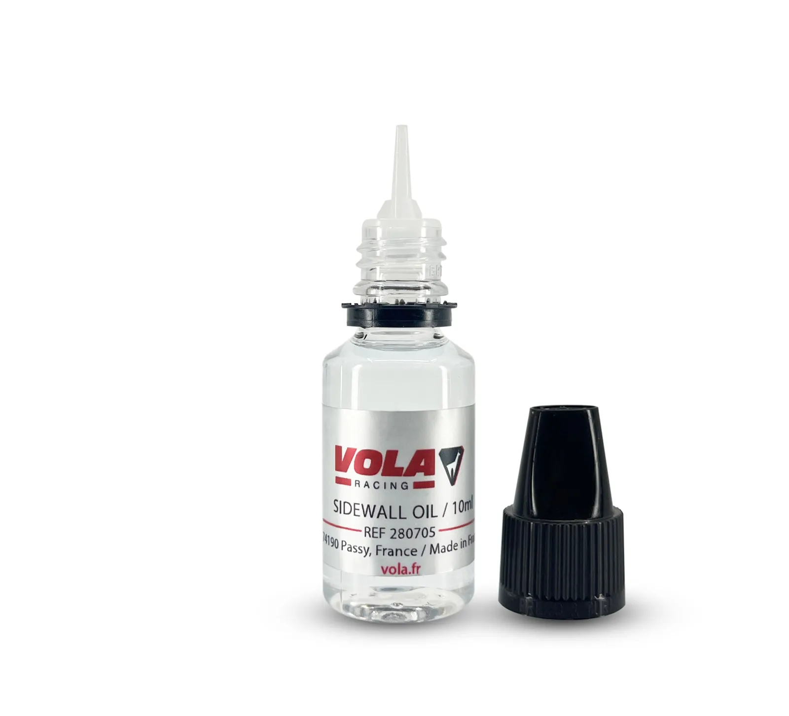 Petit flacon d'huile transparent avec applicateur, bouchon à vis noir à côté. Étiquette avec "VOLA RACING SIDEWALL OIL /10ml".
