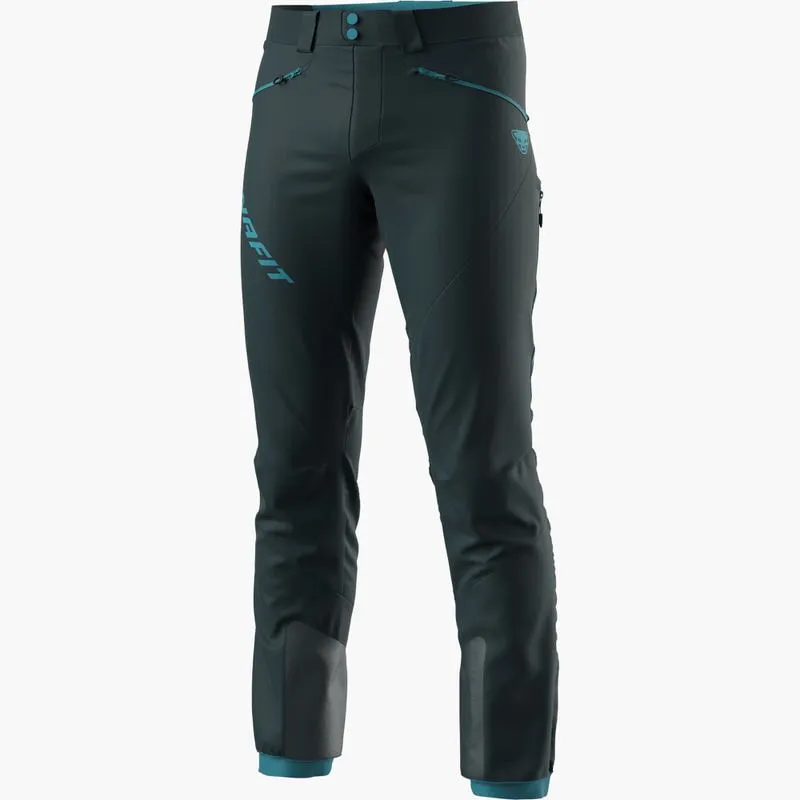 Dark blue Dynafit TLT touring pants for men with light blue accents on a white background.