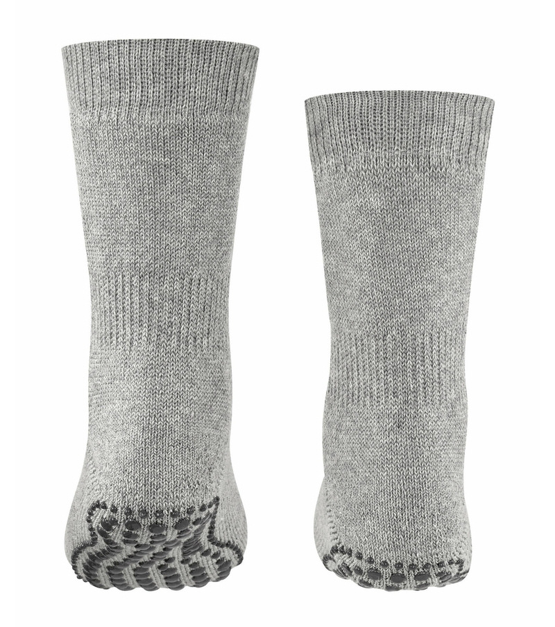 Two light gray children's socks with studs on the sole, one toe is slightly angled.