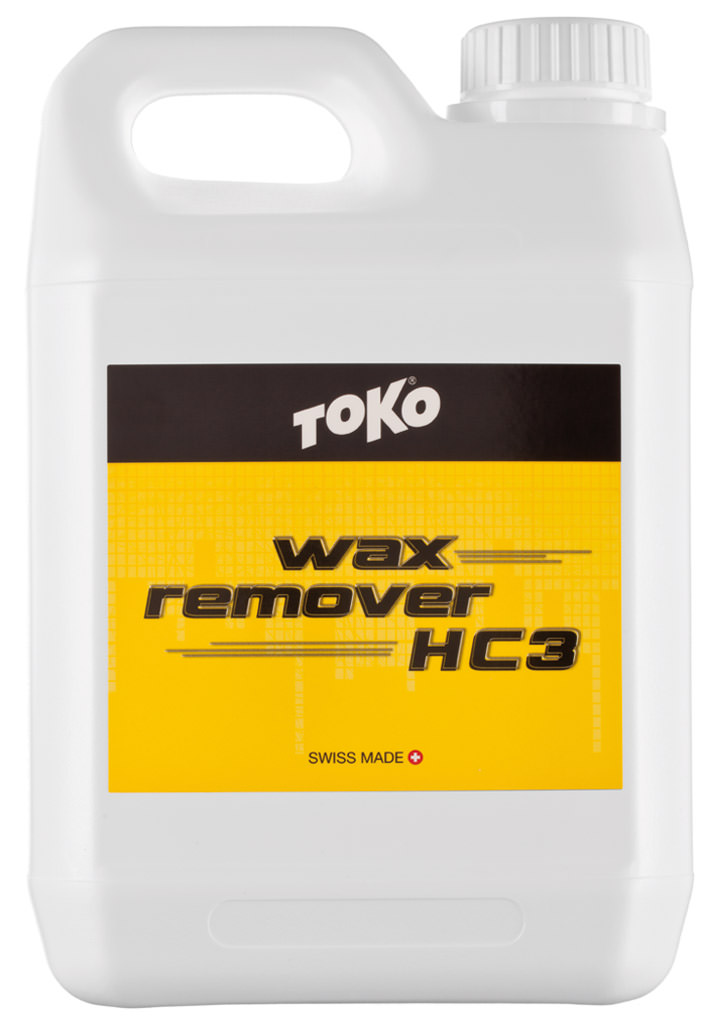 Weiße Kunststoffflasche mit Griff, Etikett "Toko Waxremover HC3", gelber Hintergrund.