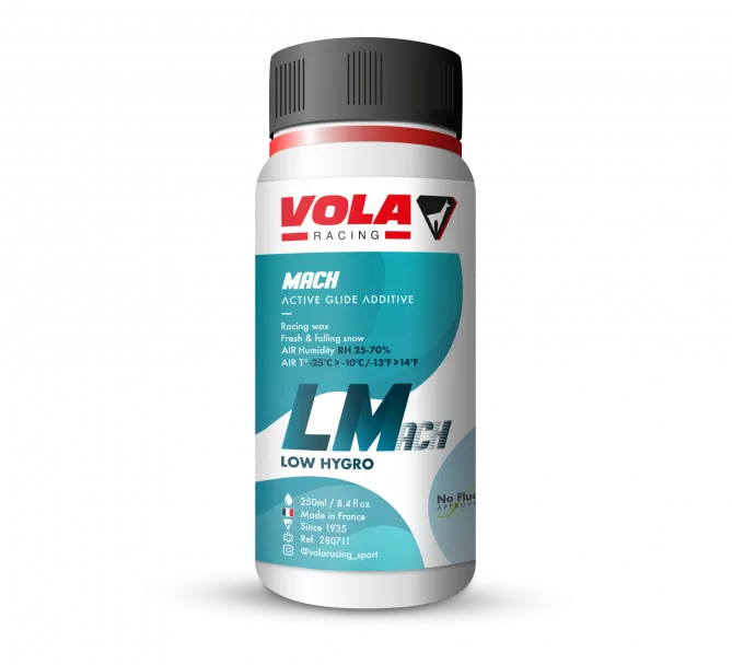 Une bouteille de cire liquide Vola LMach Blue. Inscription bleue sur fond blanc. Produit pour faible humidité.