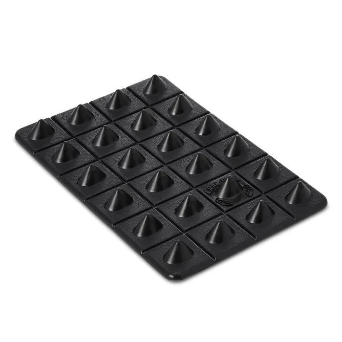 Black, rectangular snowboard stomp pad featuring 30 aggressive, cone-shaped spikes in a grid pattern. The Crab Grab Shark Teeth Pad offers maximum grip and traction for a secure footing, ideal for lift rides and one-foot riding.