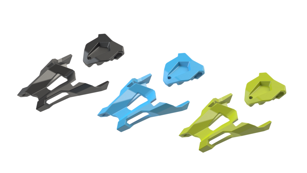Drei Paare farbige Fritschi Tecton 13 Color Clips in Schwarz, Blau und Gelbgrün, schwebend vor weißem Hintergrund.