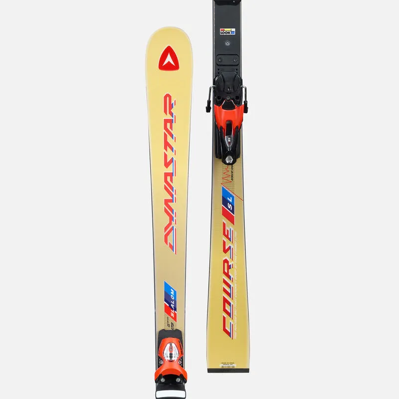 A pair of Dynastar course slalom skis with bindings, lined up vertically in front of a gray background.