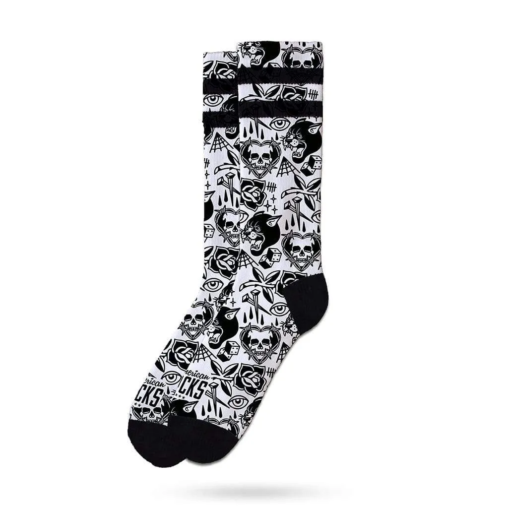 White skater socks with black cuff, heel and toes. Pattern with skulls, panthers, eyes and roses.