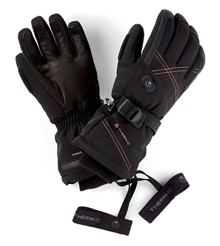 Zwei schwarze Therm-ic Ultra Heat Gloves Women, einer mit Lederinnenfläche, der andere mit Riemen.