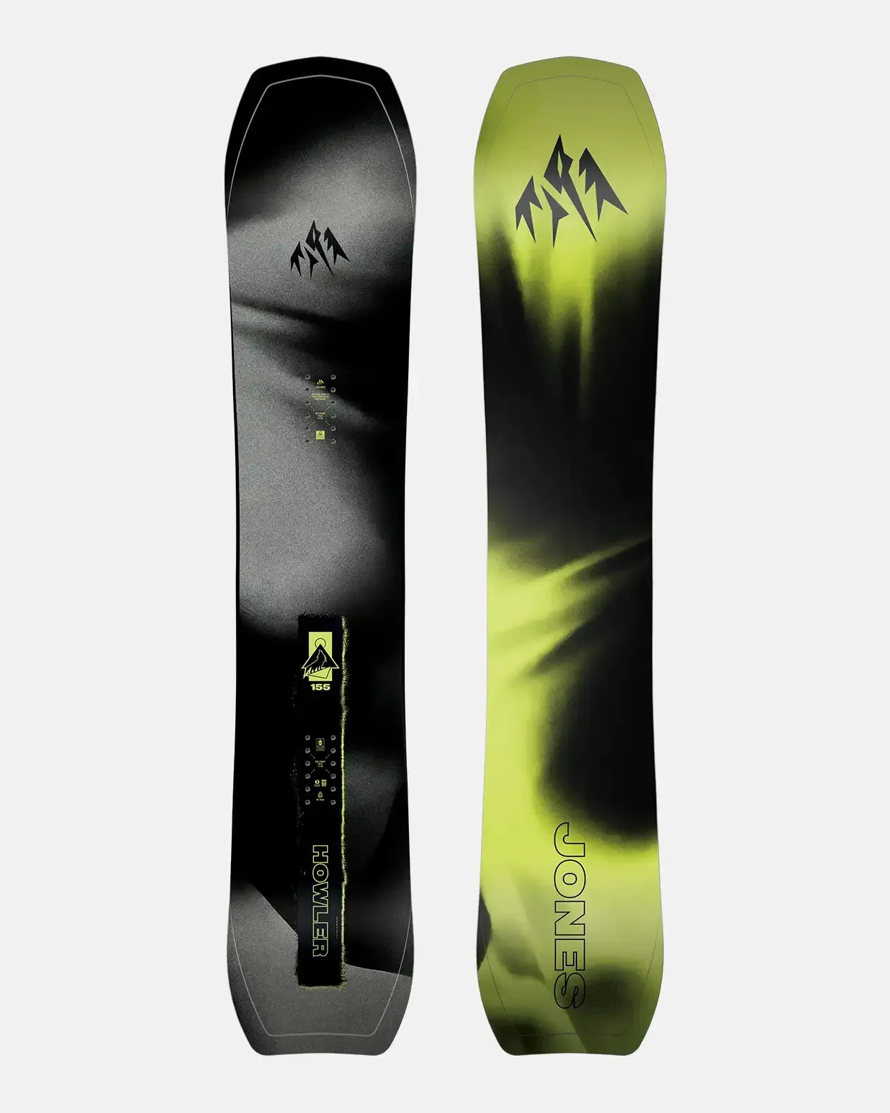 Two snowboards, one black with gray accents and the other yellow and black, standing upright next to each other.