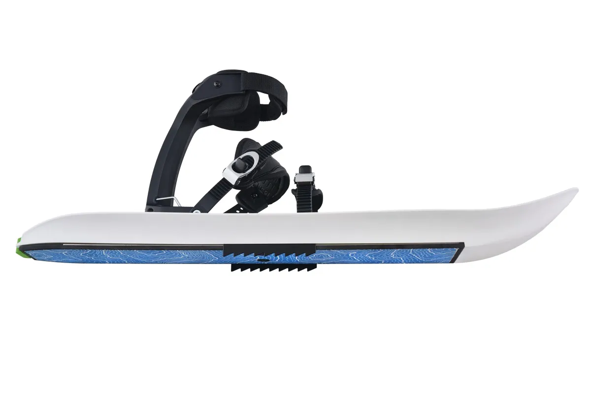 Crossblades with mounted crampons in side view. White ski with blue details and black binding.
