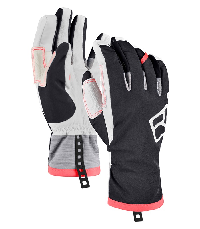 Zwei Ortovox Tour Glove W Black Raven Ski-Handschuhe. Die Innenseiten sind weiß, die Außenseiten schwarz. An den Handgelenken befinden sich graue Bündchen.