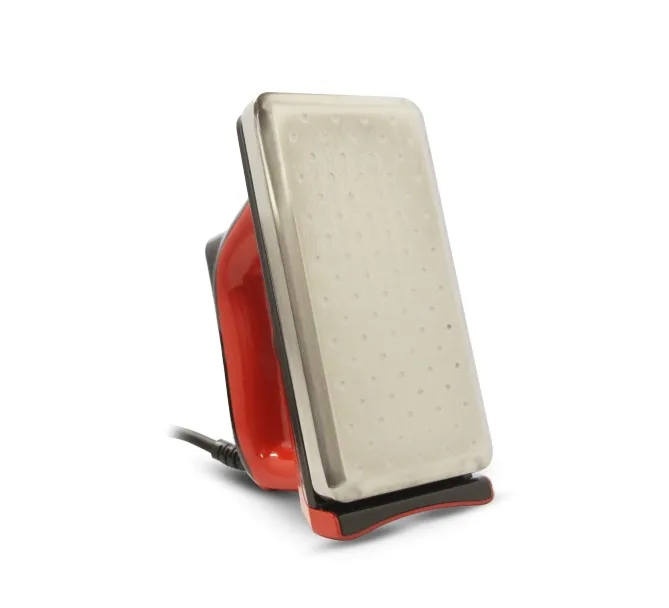 Red wax iron with silver ironing surface and black cable, upright.