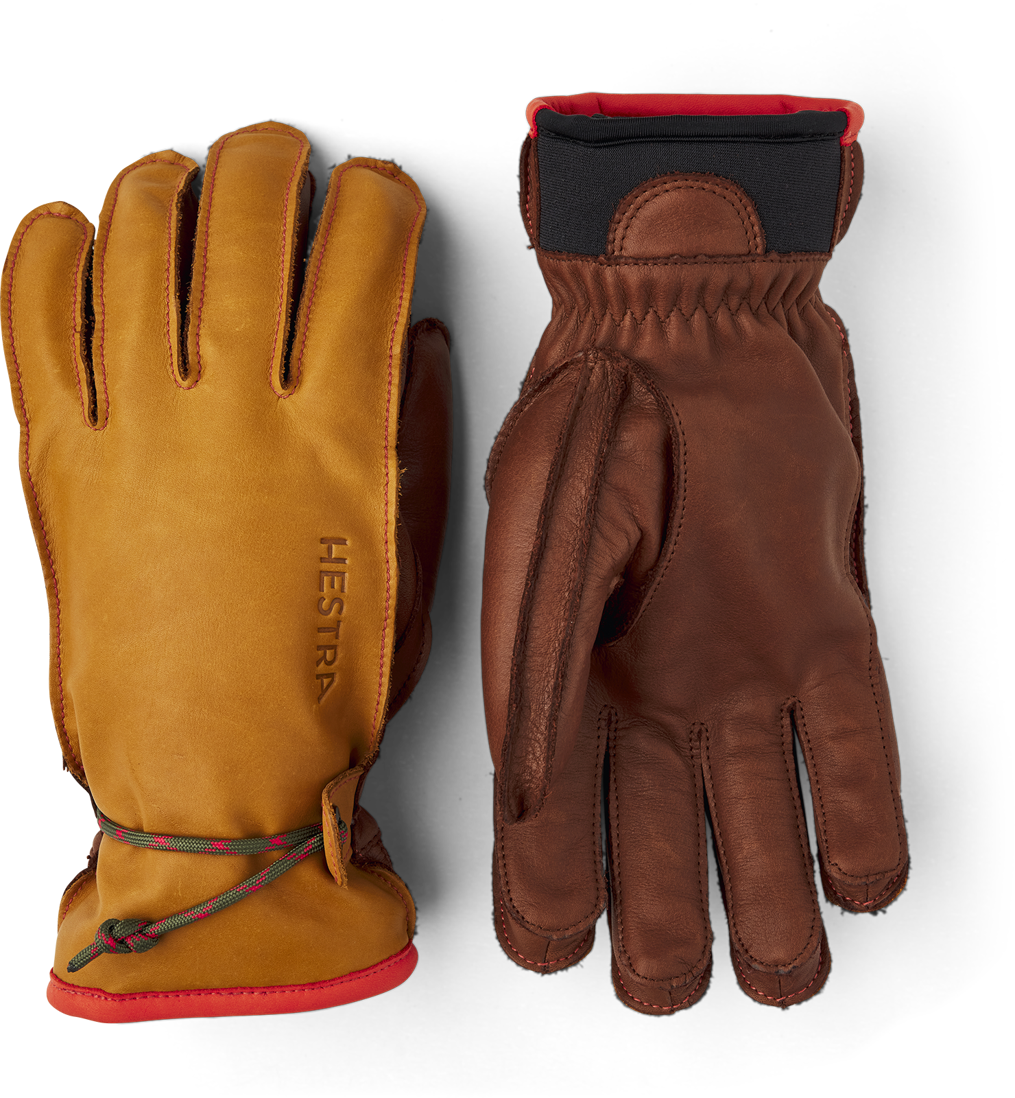 Hestra Wakayama Handschuhe Zwei Hestra Wakayama Handschuhe, braunes und gelbes Leder mit roter Akzentuierung, liegen auf einem weißen Hintergrund.