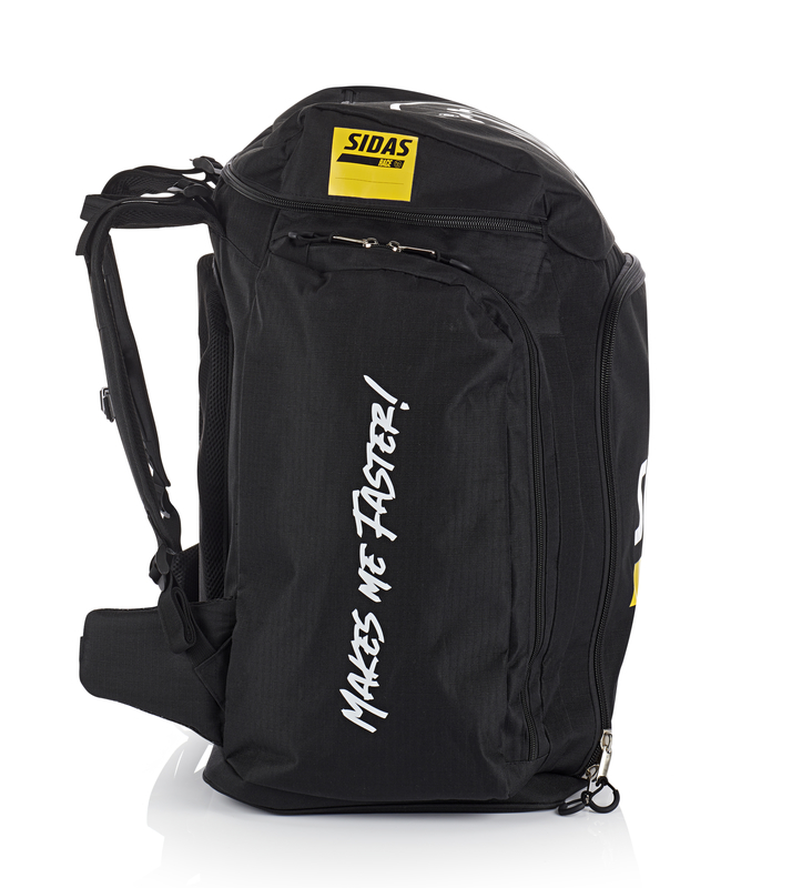 Borsa porta scarpe da corsa Sidas nera, vista laterale. Stampa "MAKES ME FASTER!". Logo Sidas giallo sulla parte superiore. Cinghie dello zaino visibili.