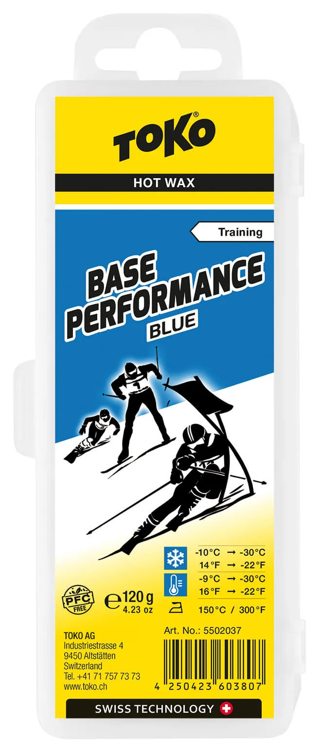 Verpackung von Toko Base Performance Blue Skiwachs mit Schneesport-Motiven und Temperaturangaben.