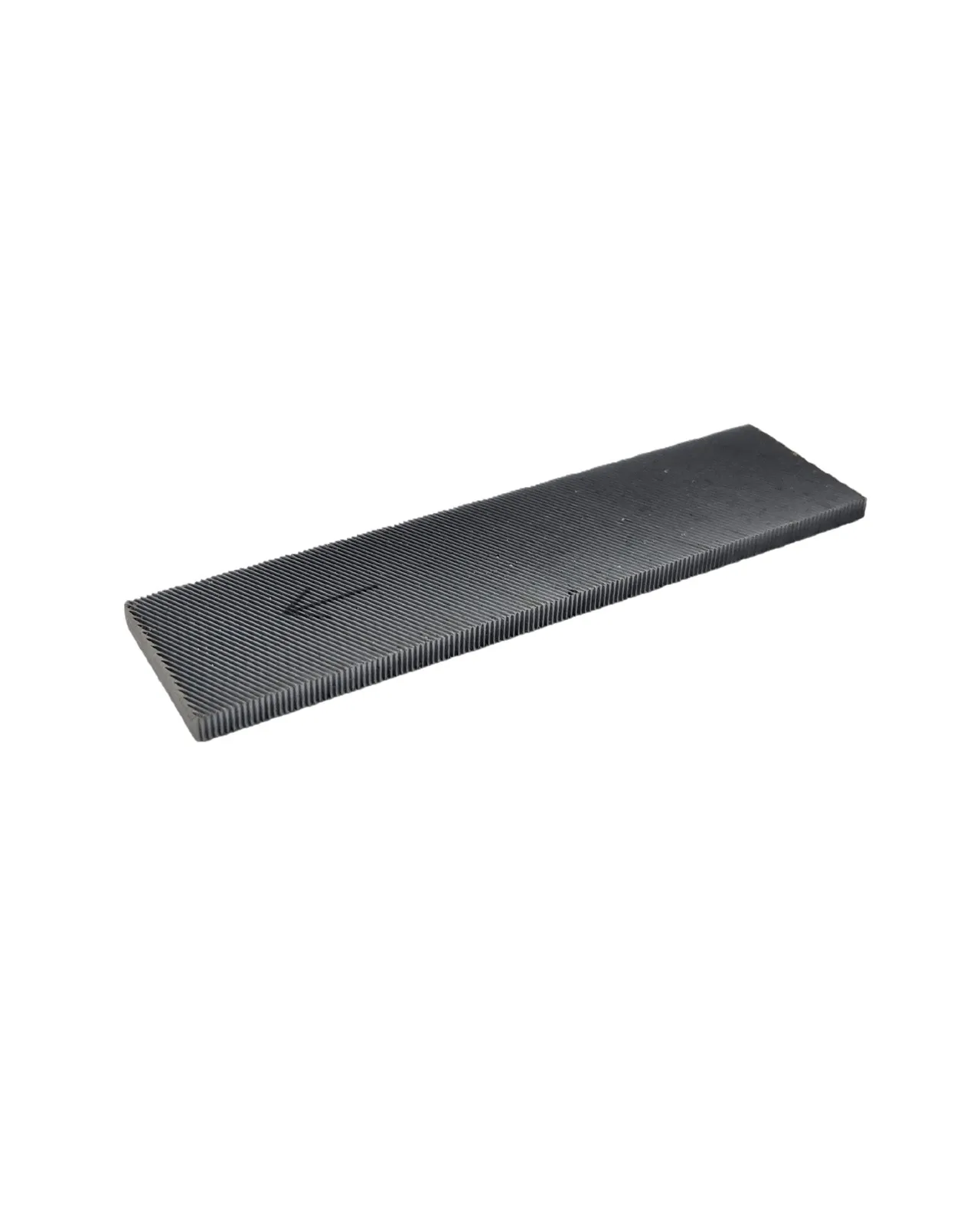 Rectangular, dark object with corrugated surface, perspective shot from diagonally above.