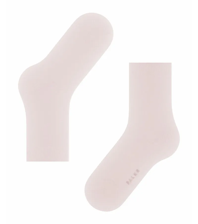 Due calzini da donna rosa chiaro; un paio di calzini Falke Cotton Touch, piatti.