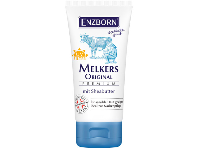 Tube blanc Enzborn Melkers Beurre de karité premium original avec illustration de vache et de trayeur. Filtre UV et texte.