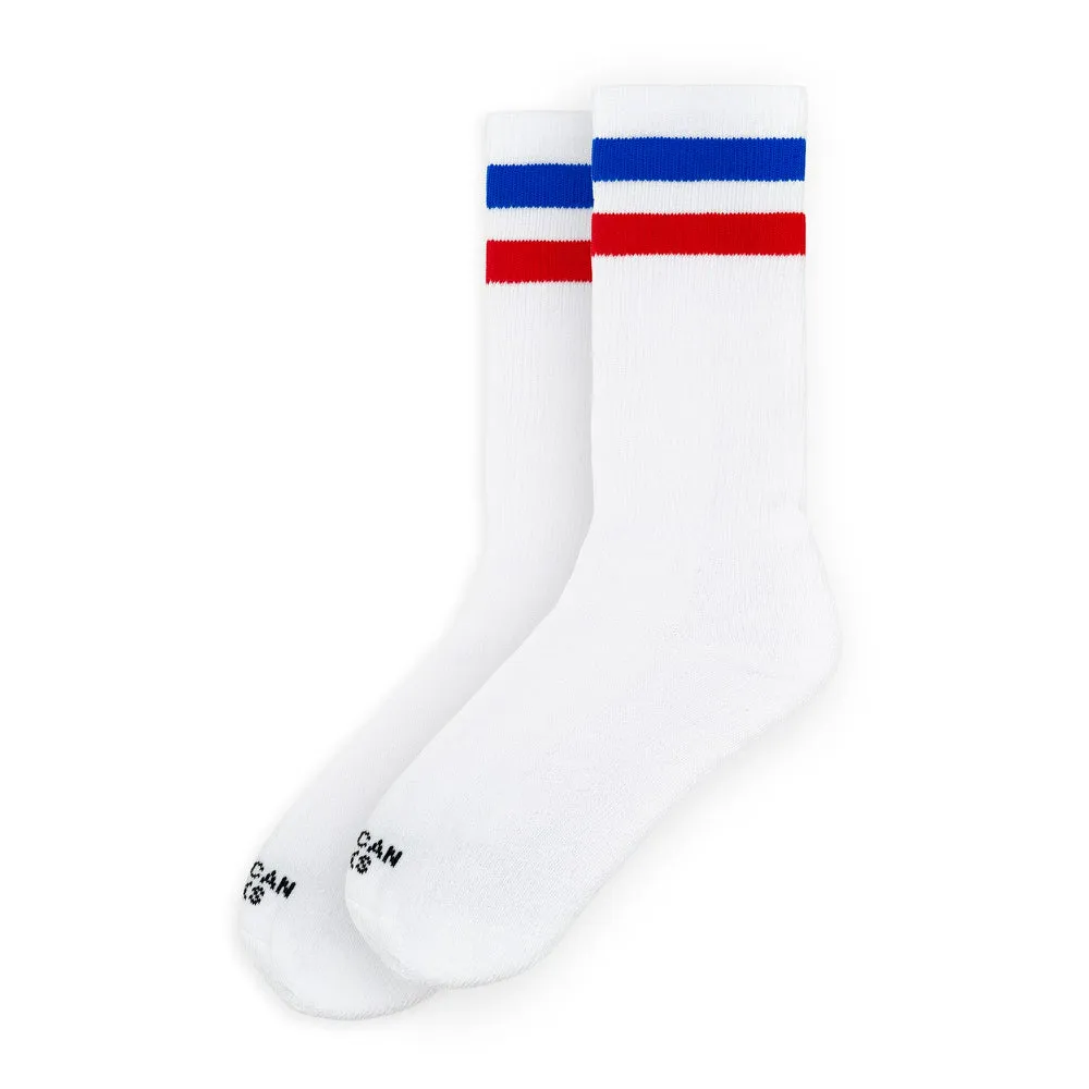 White mid high socks with red and blue stripes on the cuff.