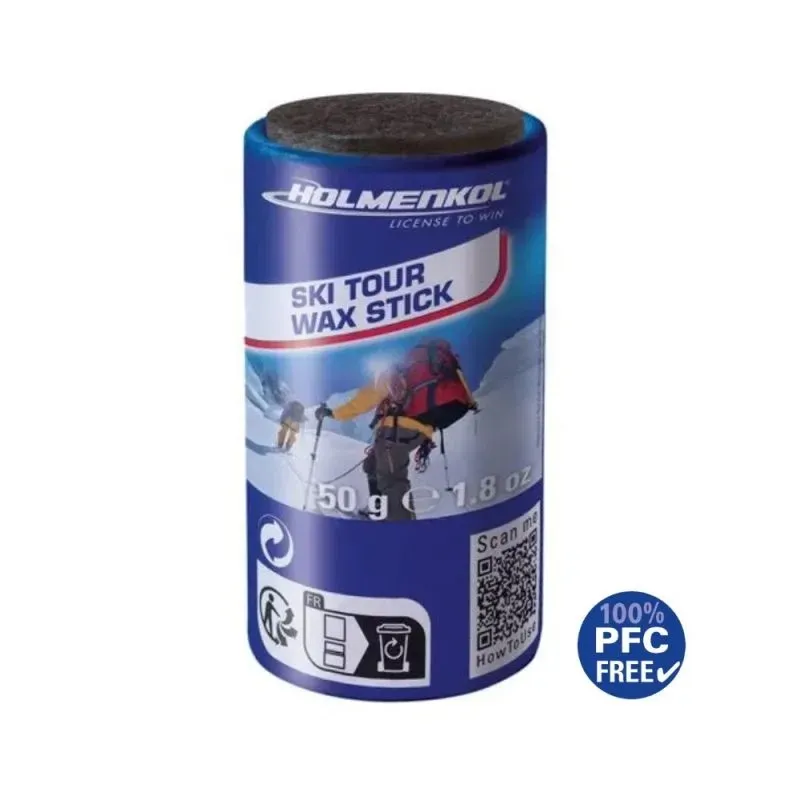 Ein blauer Ski Tour Wax Stick von Holmenkol. Oben ist ein dunkler, runder Applikator, und ein Bergsteiger ist abgebildet.