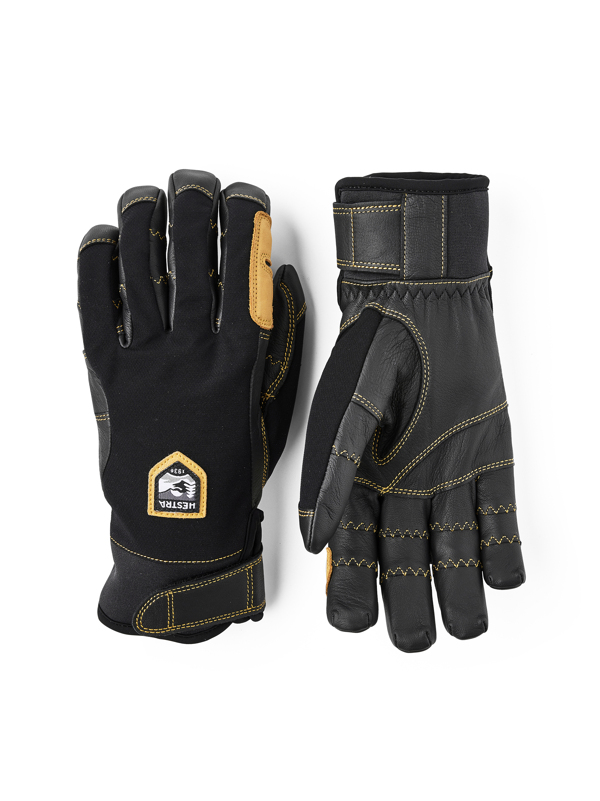 Hestra Ergo Grip Handschuhe Zwei Outdoor-Handschuhe Hestra Ergo Grip Active, einer mit Handfläche aus Leder, der andere mit Hestra-Logo auf dem Handrücken.