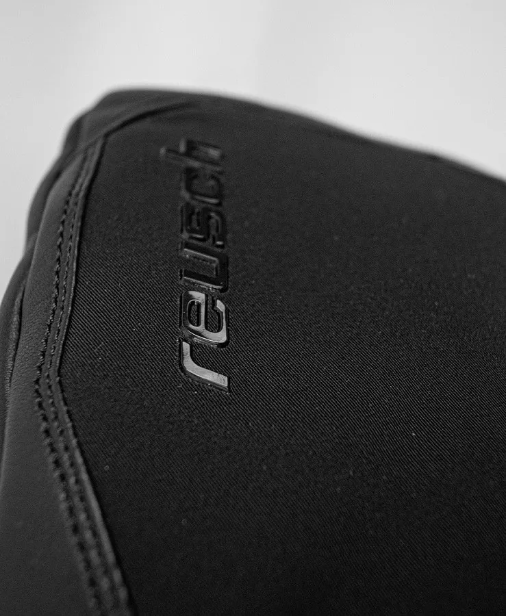 Close-up of the Reusch Volcano Pro GTX Mitten glove, black material with Reusch logo.