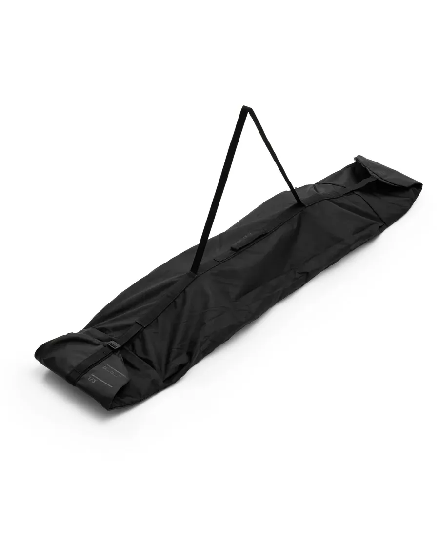 Black Douchebags Snow Essential Snowboard Bag, elongated, with carrying straps.