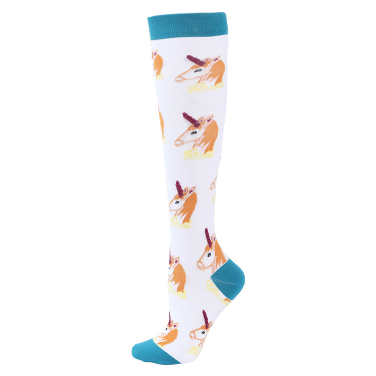 Unicorn ski sock white White ski sock with unicorn pattern and turquoise cuff/toe area.
