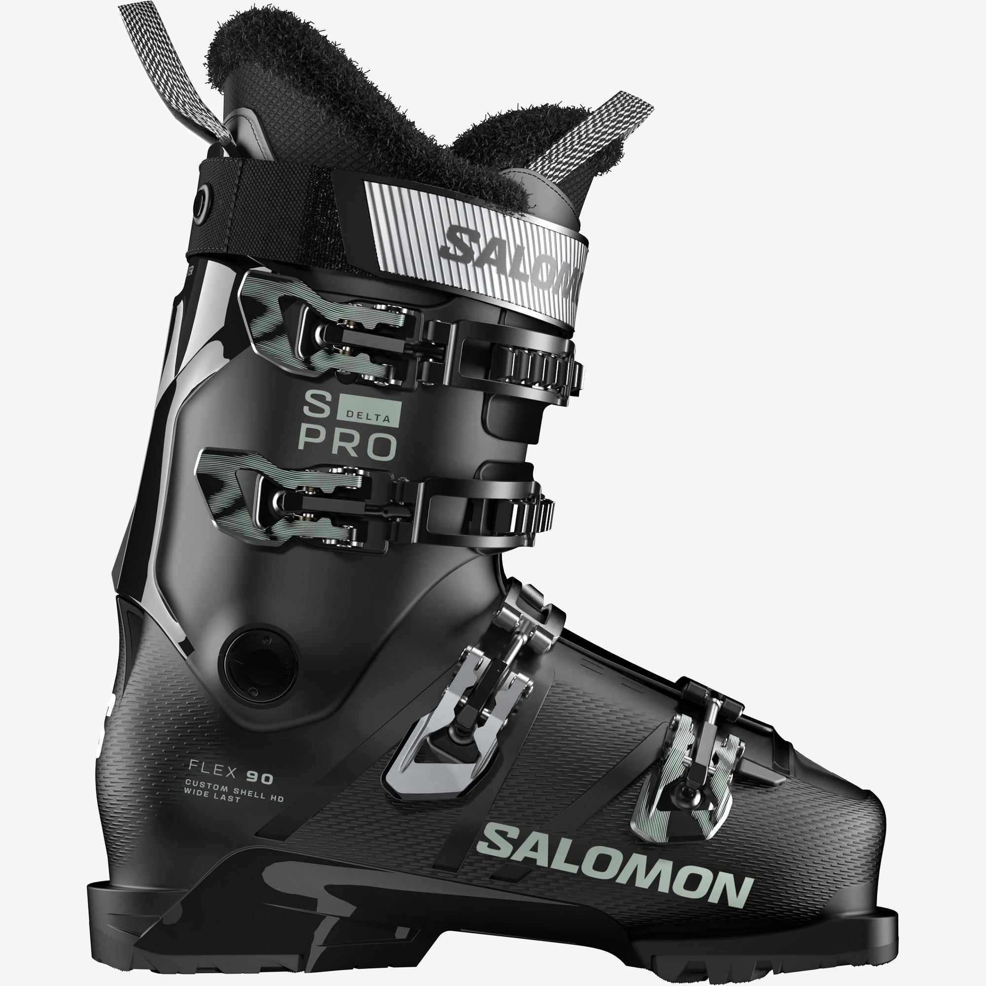 Chaussure de ski noire Salomon  Chaussure de ski noire de la marque Salomon, vue de côté avec boucles, garniture en fourrure et logo de la marque.