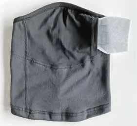 Tube gris de la communauté avec poche filtrante visible et filtre de rechange inséré.