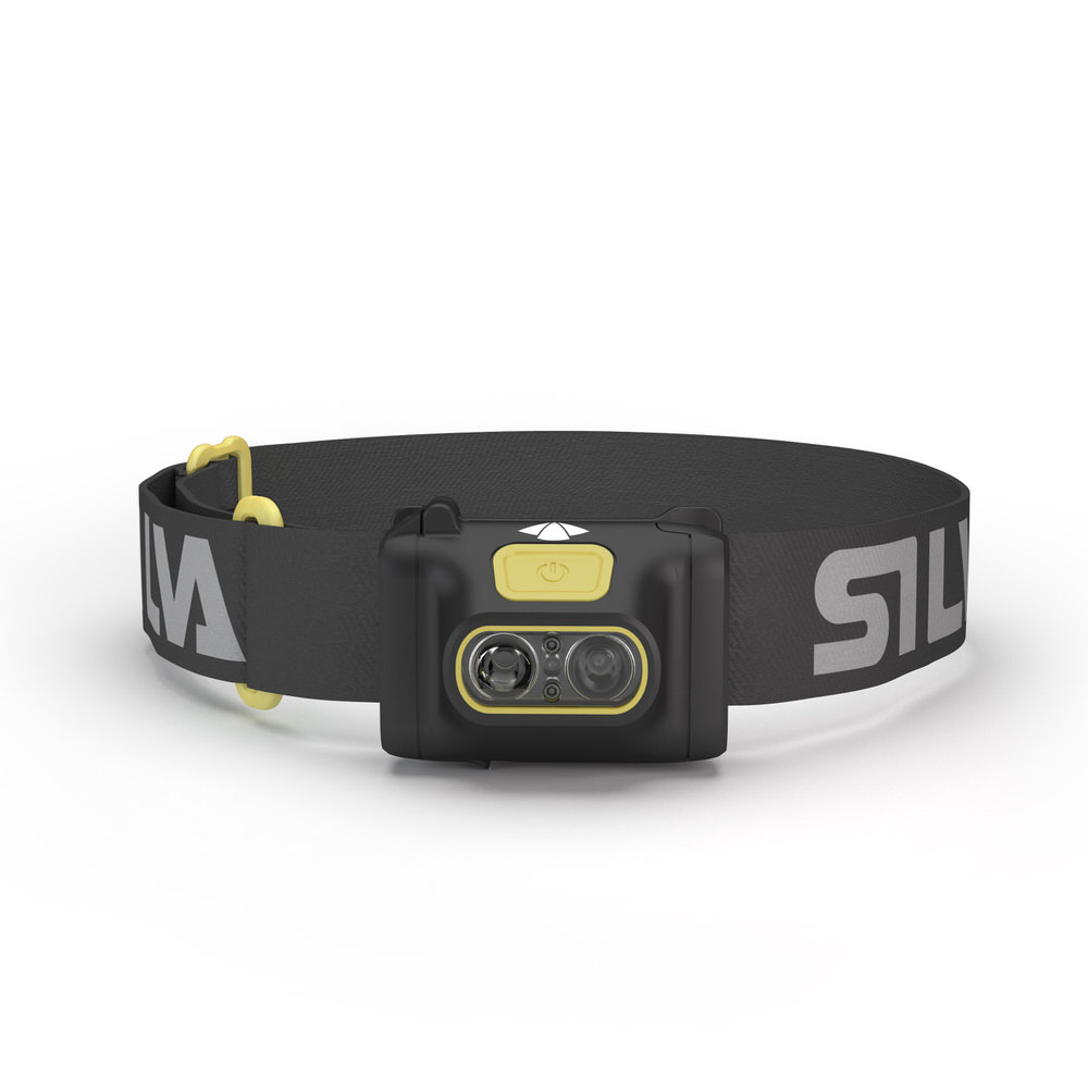 Schwarze Stirnlampe Scout 3 mit gelben Akzenten und verstellbarem, beschriftetem Kopfband vor hellem Hintergrund.