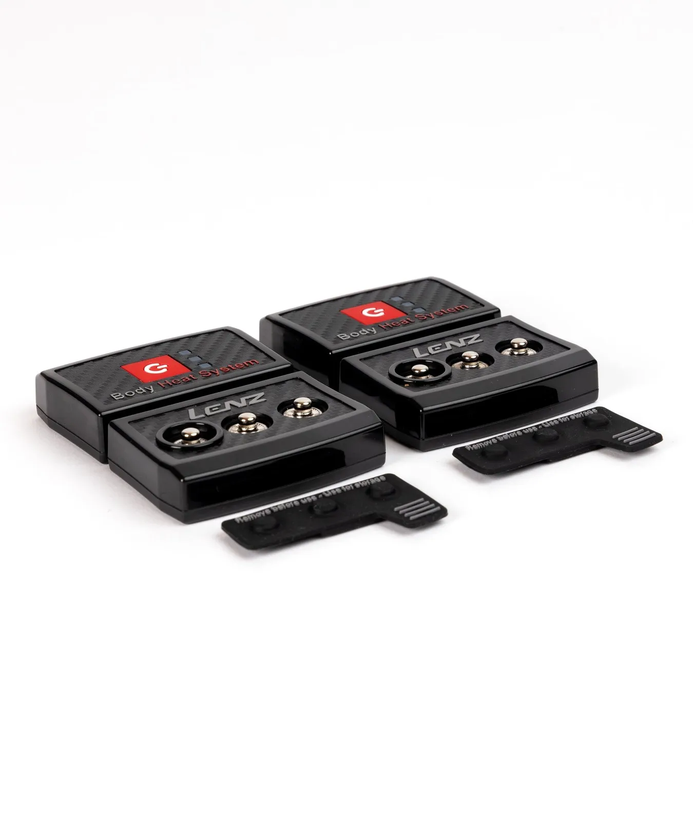 Zwei schwarze Lenz Body Heat System Controller mit zwei Abdeckungen auf weißem Grund.