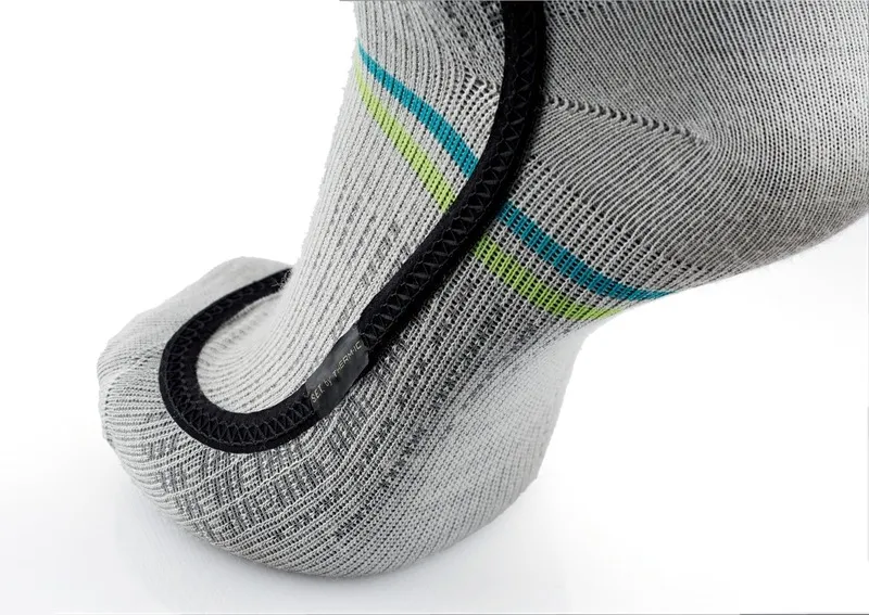 Close-up of a gray Ski Heat Race S.E.T sock with blue and green stripes and a black heating element.