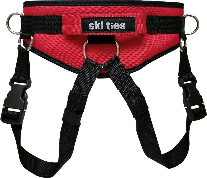 Ski-Ties rouge pour enfants avec sangles de jambe et boucles pour apprendre à skier en toute sécurité.