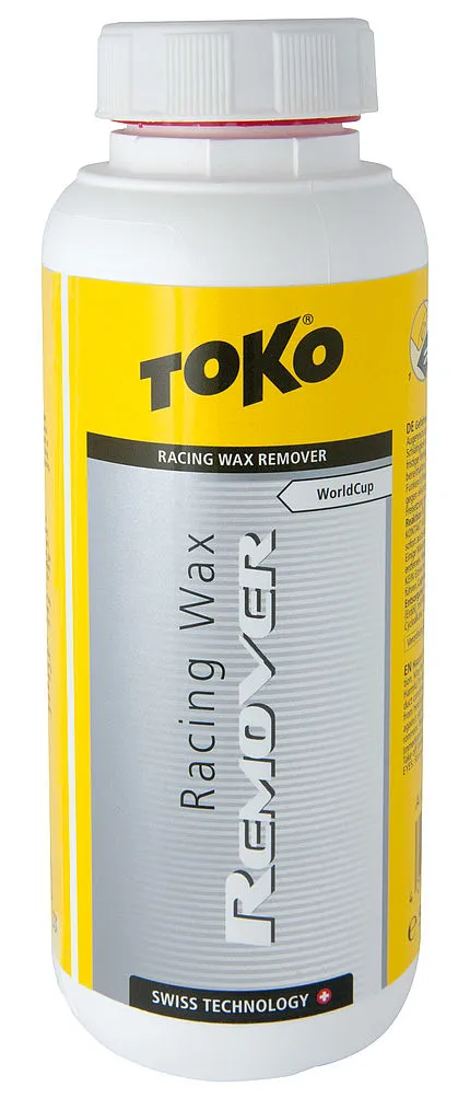 Weiße Flasche mit gelbem Etikett, Text "Toko Racing Wax Remover" in Schwarz und Silber.