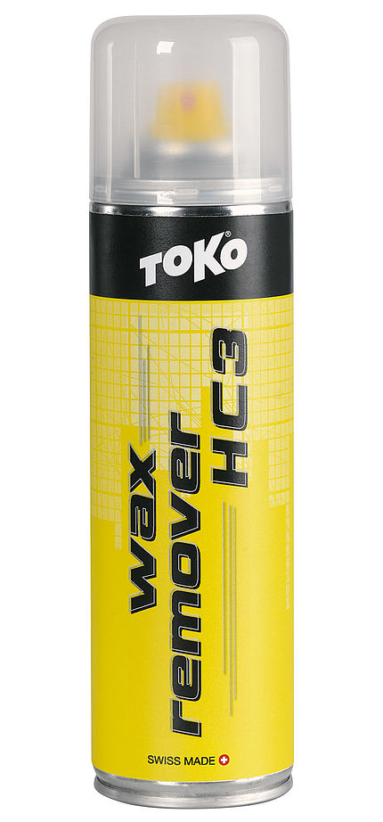 Toko Wax Remover jaune Bombe jaune Toko Wax Remover HC3 pour snowboard, avec couvercle transparent. Écriture noire sur fond jaune.