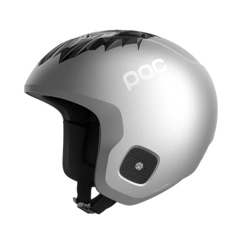 Silver-colored POC Skull Dura Junior ski helmet with black lion pattern on top and POC logo.