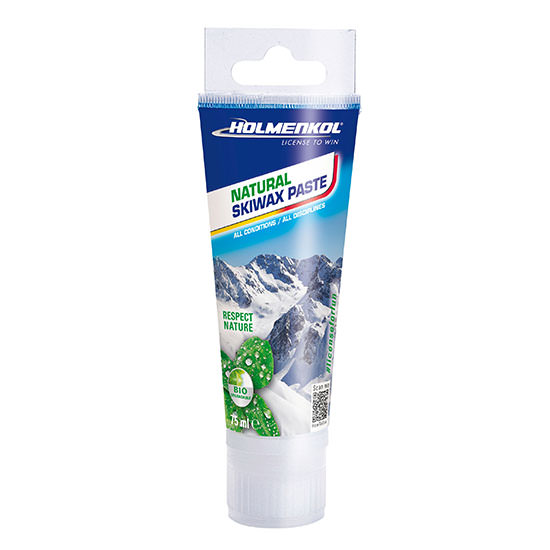 Tube mit Skiwax Paste. Aufschrift: Natural Skiwax Paste. Hintergrund: schneebedeckte Berge. Grünes Bio-Siegel.