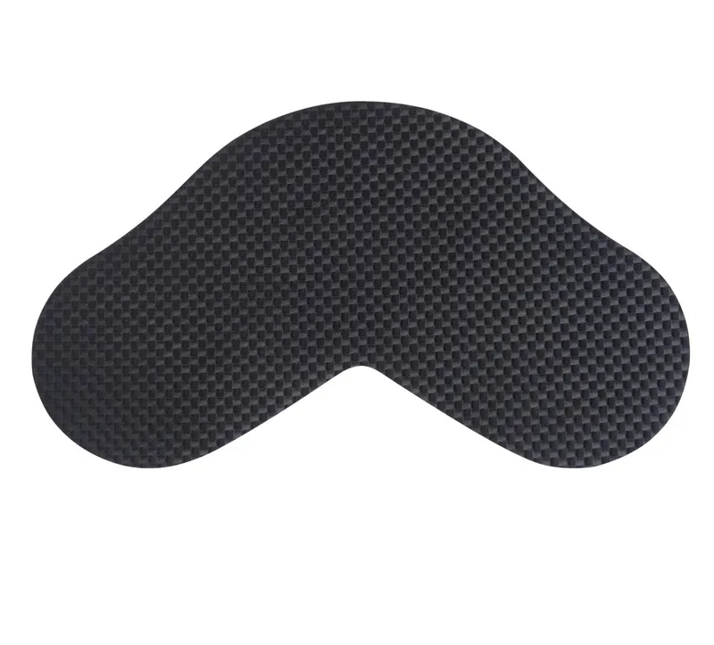 Dark gray, flat object with rounded edges and a diamond-shaped texture. The shape is asymmetrical and reminiscent of a boomerang.