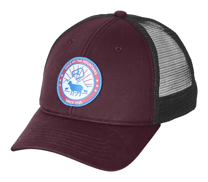 Wine-red trucker cap with black mesh insert and round patch with mountain scene and sheep.