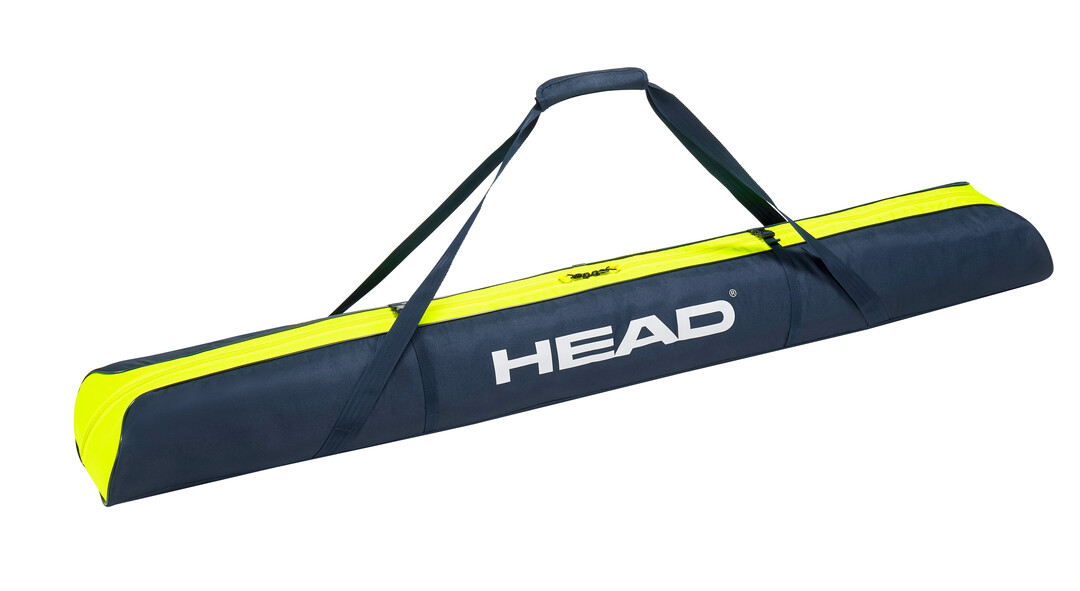 Skibag, dunkelblau mit gelben Akzenten, Tragegriff und "HEAD" Logo.