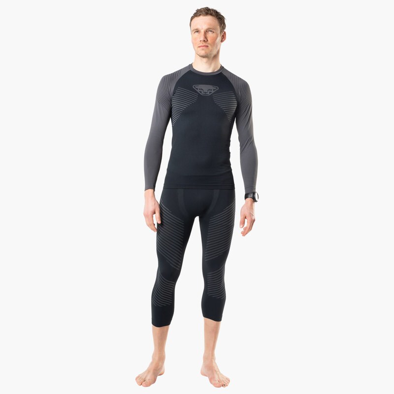 Dynafit Tenue homme L'homme porte Dynafit Speed Dryarn Tights et Longsleeve en gris/noir.