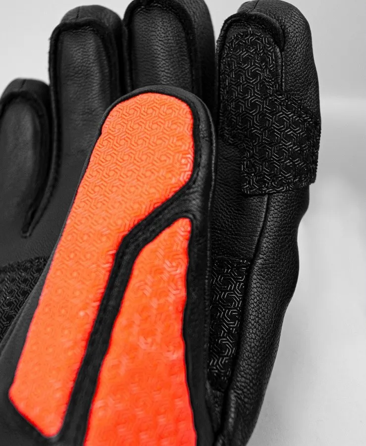 Close-up of a black Reusch Worldcup Warrior SC glove with orange print.