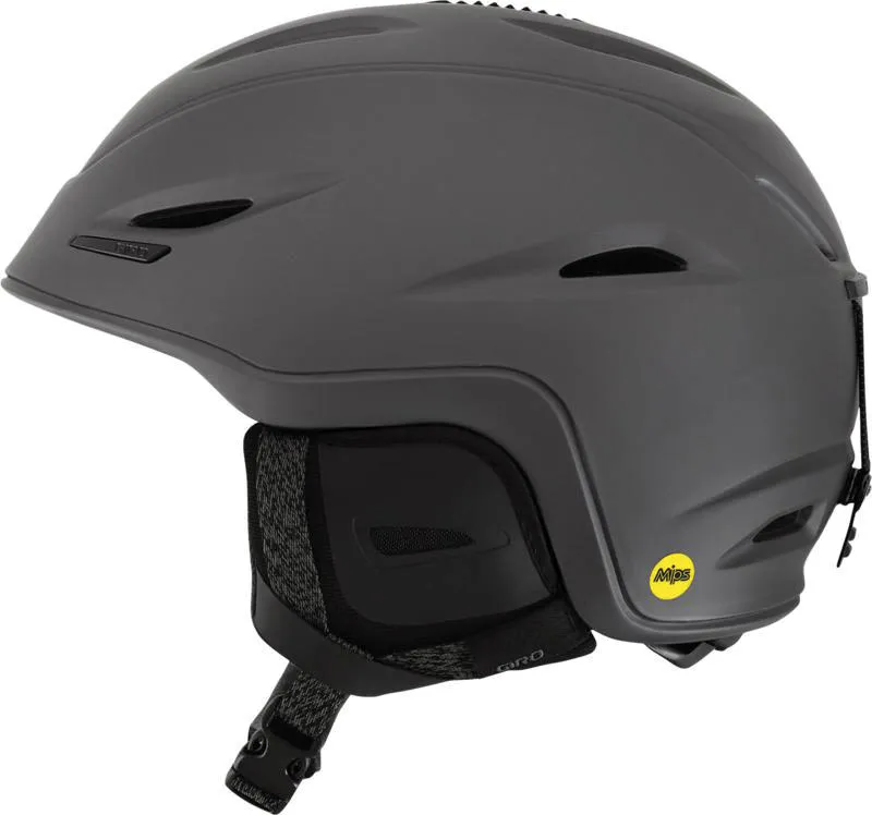 Ski helmet, Giro Union Mips in matt titanium gray, side view, MIPS logo visible, ear pads and chin strap.