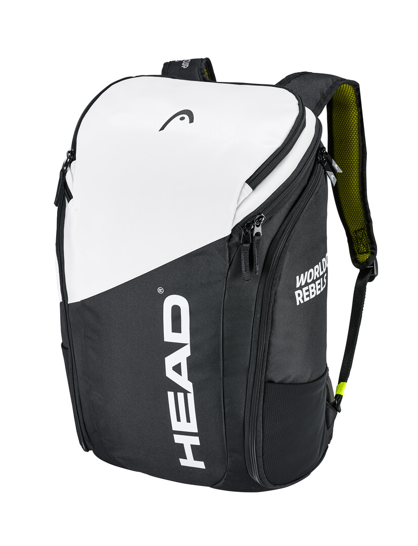 Un sac à dos Head Rebels, blanc et noir, avec des fermetures éclair et des bretelles, des compartiments à chaussures sur le côté et le logo Head imprimé.