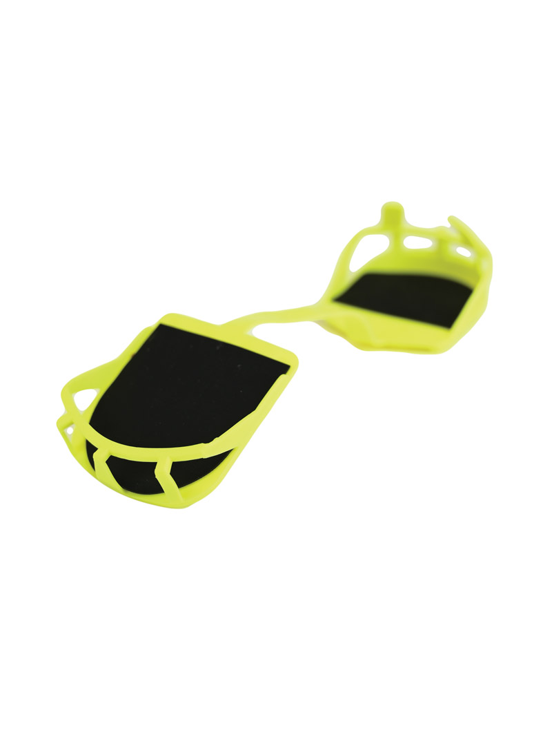 Neon-gelbe Cat Tracks Ski Sohlen mit schwarzer Unterseite, verbunden durch einen Steg.