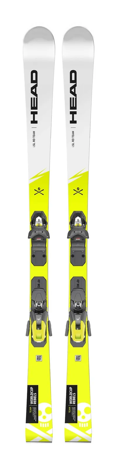 Two skis with yellow and white colors, mounted grey bindings and skull-and-crossbones graphics.