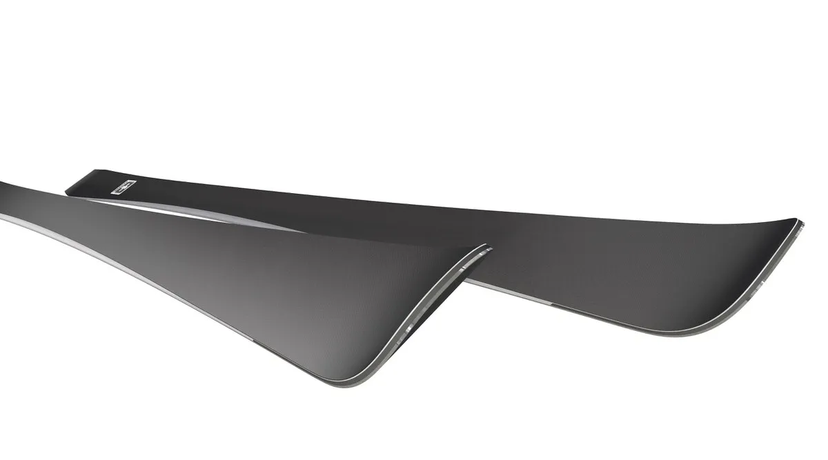Two Ramser skis, angled. Dark surface, slightly curved shape.