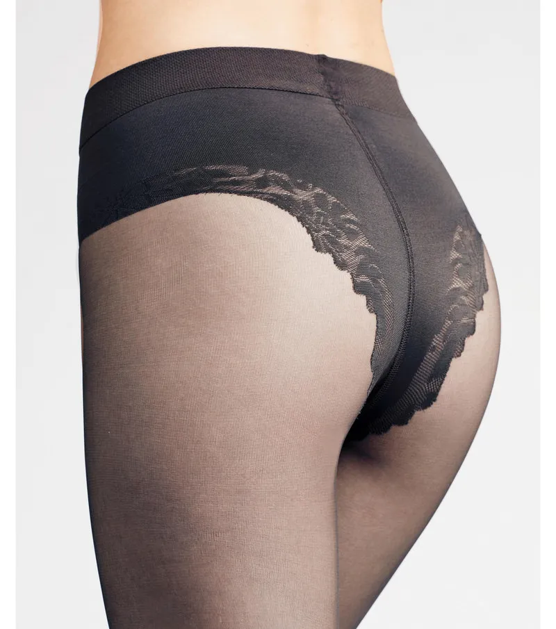 Close-up: Black women's tights (20 DEN) with shaping effect in the hip area.